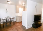 Thumbnail 16 of 46 - a kitchen and dining room with a table