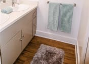 Thumbnail 17 of 46 - a bathroom with a sink and a mirror