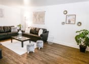 Thumbnail 18 of 46 - a living room with leather couches and a table