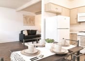 Thumbnail 24 of 46 - a kitchen and dining room with a table and chairs