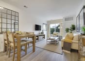 Thumbnail 45 of 80 - a living room and dining room with a table and chairs