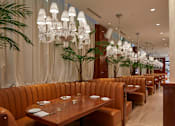 Thumbnail 36 of 41 - Elegant restaurant dining room with chandeliers at Bay One Apartments, New Jersey, 07002