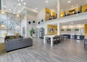 Thumbnail 8 of 80 - a living room and dining room with a table and chairs