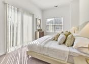 Thumbnail 57 of 80 - a bedroom with a large bed and a large window