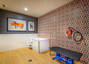 Thumbnail 19 of 53 - Fitness studio with equipment and retro wallpaper at Inwood at Renaissance Square Apartments, Marlton, NJ 08053