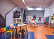 Thumbnail 18 of 53 - Colorful childrens playroom with educational toys and activities at Inwood at Renaissance Square Apartments, Marlton, NJ