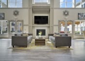 Thumbnail 9 of 80 - a living room with couches and a table and a fireplace