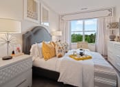 Thumbnail 51 of 80 - a bedroom with a large bed and a window