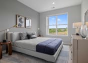 Thumbnail 49 of 61 - a bedroom with a bed and a window
