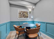 Thumbnail 13 of 70 - Private dining room with blue wainscoting accents at Aster Grove Apartments, Warren
