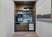Thumbnail 14 of 70 - Built in coffee bar with beverage center and shelving at Aster Grove Apartments, Warren