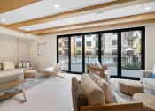 Thumbnail 19 of 61 - a living room with couches and chairs and sliding glass doors