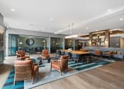 Thumbnail 5 of 61 - a lounge area with chairs and tables and a pool table