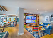 Thumbnail 8 of 53 - Open concept living area with entertainment center and lounge seating at Inwood at Renaissance Square Apartments, Marlton, 08053