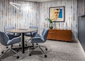 Thumbnail 11 of 53 - Conference room with round table and modern lighting at Inwood at Renaissance Square Apartments, Marlton, NJ 08053