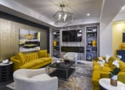 Thumbnail 6 of 80 - a living room with yellow couches and a television
