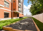 Thumbnail 38 of 80 - bocce ball court in front of a brick building