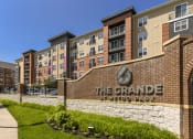 Thumbnail 71 of 80 - a brick building with the grande metro park sign in front of it