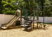 Thumbnail 37 of 80 - a playground with a slide and climbing equipment in a backyard