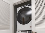 Thumbnail 48 of 80 - a white front loader washer and dryer in a closet