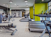 Thumbnail 14 of 53 - Spacious gym with treadmills and weight equipment at Inwood at Renaissance Square Apartments, Marlton