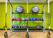 Thumbnail 16 of 53 - Functional training area with suspension straps and equipment storage at Inwood at Renaissance Square Apartments, New Jersey, 08053
