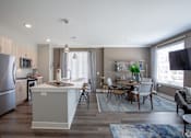 Thumbnail 35 of 53 - Open concept living and dining space with kitchen island at Inwood at Renaissance Square Apartments, Marlton, NJ
