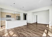 Thumbnail 30 of 53 - Open layout living and kitchen area with wood flooring at Inwood at Renaissance Square Apartments, Marlton