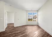 Thumbnail 49 of 53 - Empty room with window and wood laminate flooring at Inwood at Renaissance Square Apartments, New Jersey