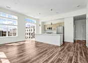 Thumbnail 31 of 53 - Open concept living area with kitchen island and large windows at Inwood at Renaissance Square Apartments, New Jersey, 08053