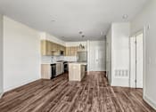 Thumbnail 32 of 53 - Open living space with wood cabinetry and peninsula at Inwood at Renaissance Square Apartments, Marlton, NJ 08053