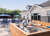 Thumbnail 8 of 44 - Outdoor Courtyard with Grilling Stations and Firepits