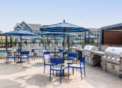 Thumbnail 5 of 44 - Outdoor Courtyard with Grilling Stations and Firepits