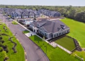 Thumbnail 42 of 44 - an aerial view of a large house with a pool in front of it