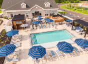 Thumbnail 3 of 44 - Expansive Outdoor Courtyard with Pool and Lounge Seating