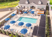 Thumbnail 2 of 44 - Expansive Outdoor Courtyard with Pool and Lounge Seating