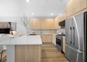 Thumbnail 20 of 30 - Stainless steel refrigerator in kitchen at The Lawrence, New Jersey, 07054