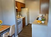 Thumbnail 7 of 11 - Traditional kitchen with original cabinetry and appliances in a classic 2-bedroom apartment at Lynnhaven Landing in Virginia Beach
