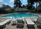 Thumbnail 2 of 11 - Outdoor community pool at Lynnhaven Landing Apartments in Virginia Beach, offering residents a place to relax and enjoy the sun