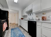 Thumbnail 9 of 28 - a kitchen with white cabinets at The Dresden, Las Vegas, NV, 89122