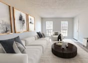 Thumbnail 6 of 22 - A living room with a white couch, a coffee table, and a television.