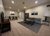 Thumbnail 12 of 28 - a living room filled with furniture and a flat screen tv