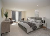 Thumbnail 11 of 28 - a bedroom with a bed and two chairs in a 555 waverly unit