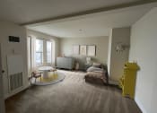 Thumbnail 14 of 28 - a bedroom with a bed and a table in a room
