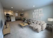 Thumbnail 10 of 28 - a living room filled with furniture and a large window