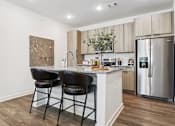 Thumbnail 43 of 46 - A kitchen with a marble countertop at The Liliana Apartment Homes, Pooler, 31322