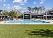Thumbnail 7 of 46 - A large swimming pool at The Liliana Apartment Homes, Georgia, 31322