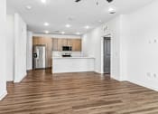 Thumbnail 59 of 124 - Open concept living room and kitchen with wood floors at Velara Luxury Apartments, Ponte Vedra Beach, Florida