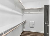 Thumbnail 60 of 124 - Spacious walk-in closet with storage shelving at Velara Luxury Apartments, Ponte Vedra Beach, FL 32081