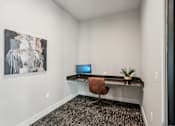 Thumbnail 53 of 57 - A room with a desk and a painting on the wall at The Stadler Luxury Apartments, Bradenton, FL 34210